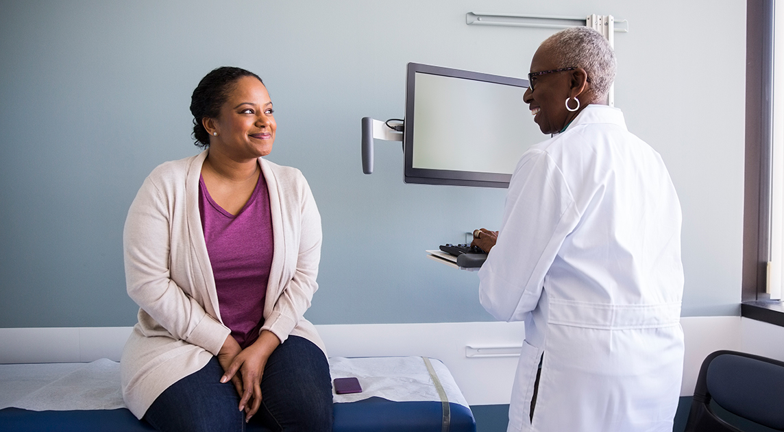 Woman talks to her doctor